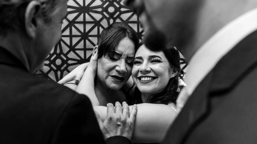 bride hugging her mother
