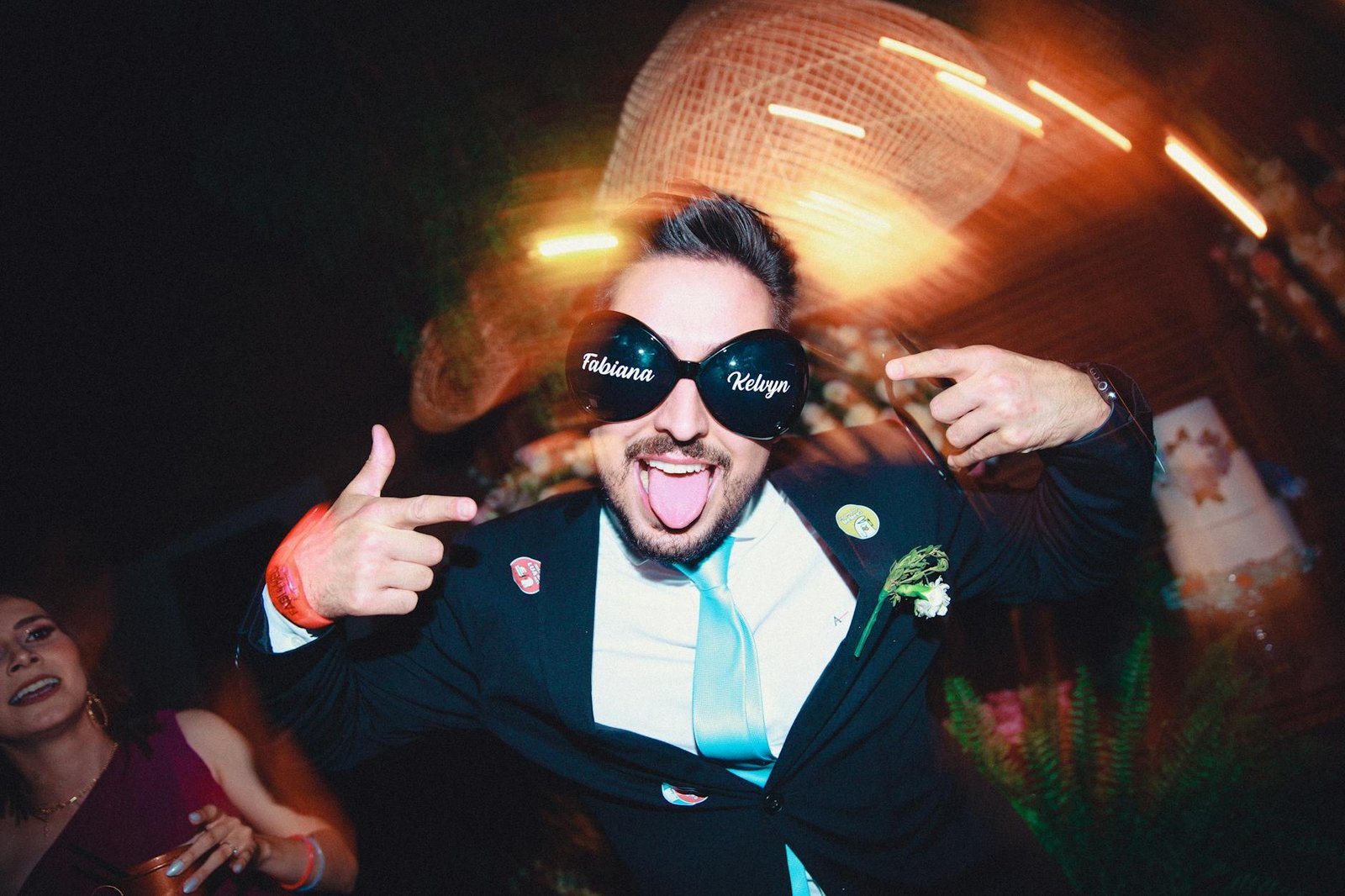 man in sunglasses dancing at party