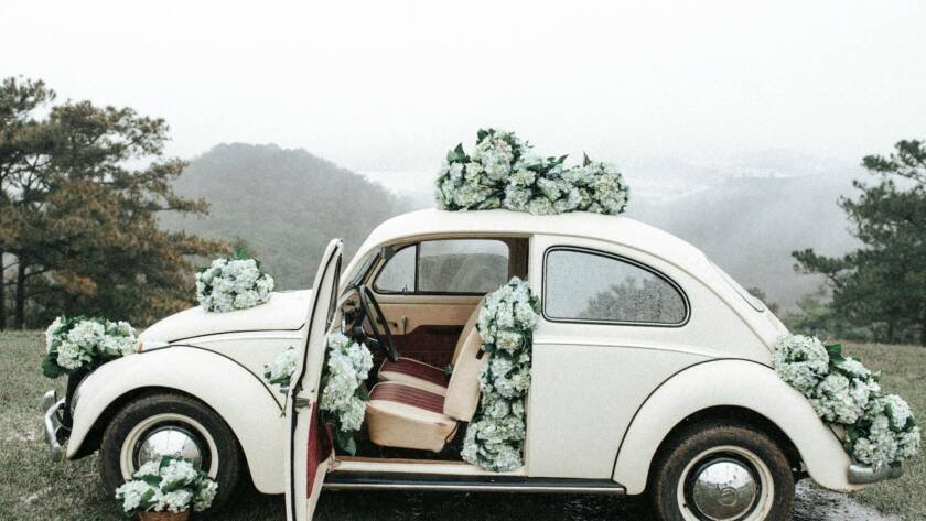 wedding flowers decoration on vintage volkswagen beetle