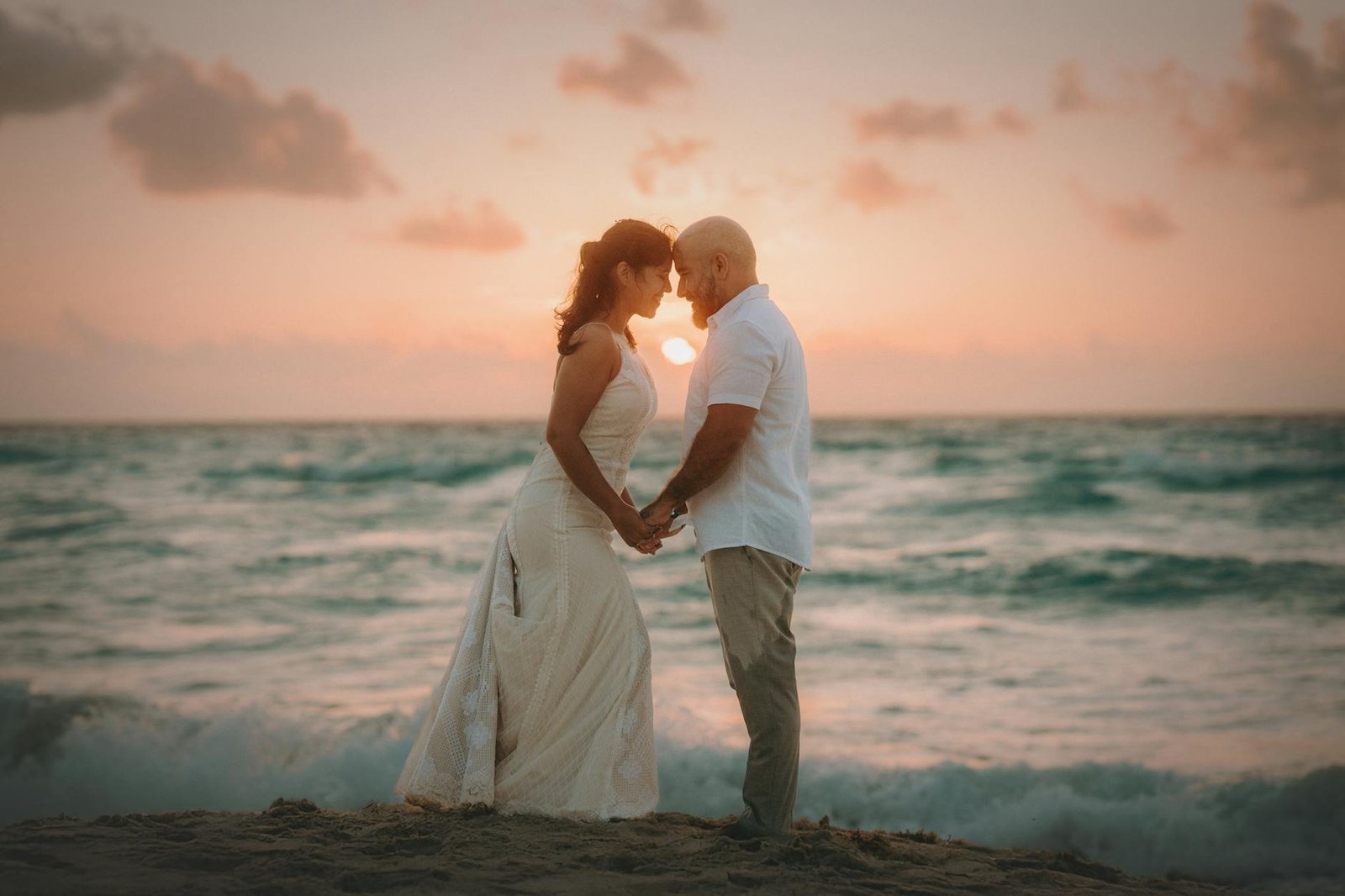 romantic beach wedding at sunset in costa mujeres