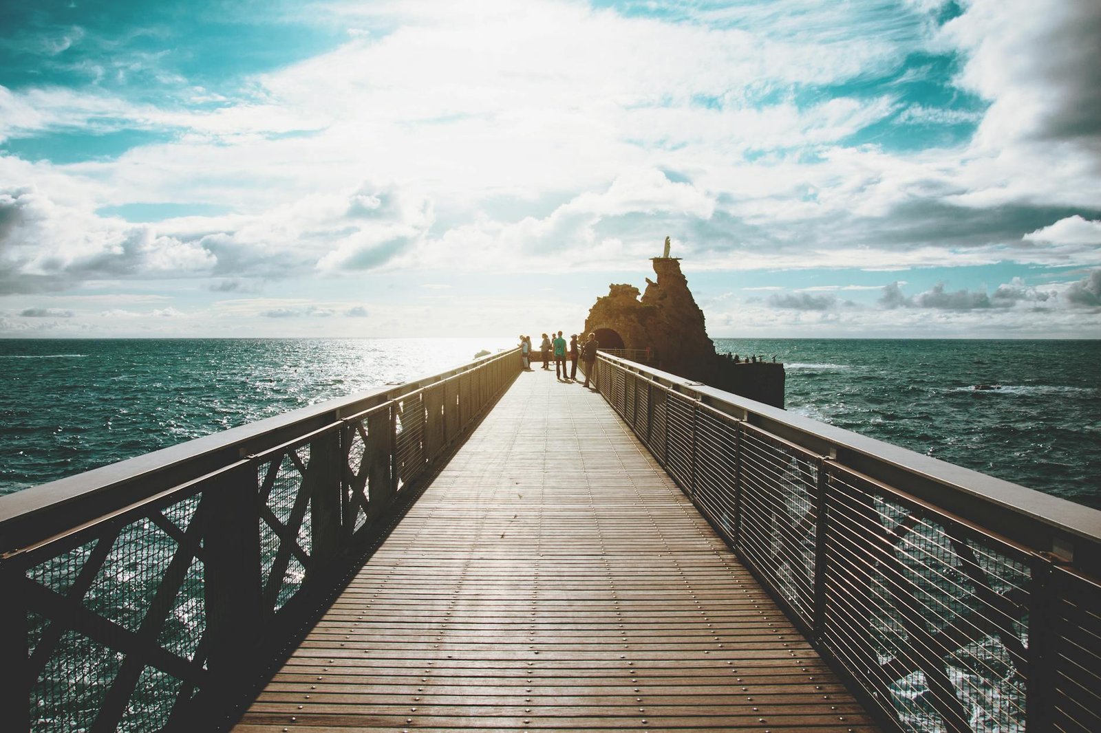people walking on wooden dock
